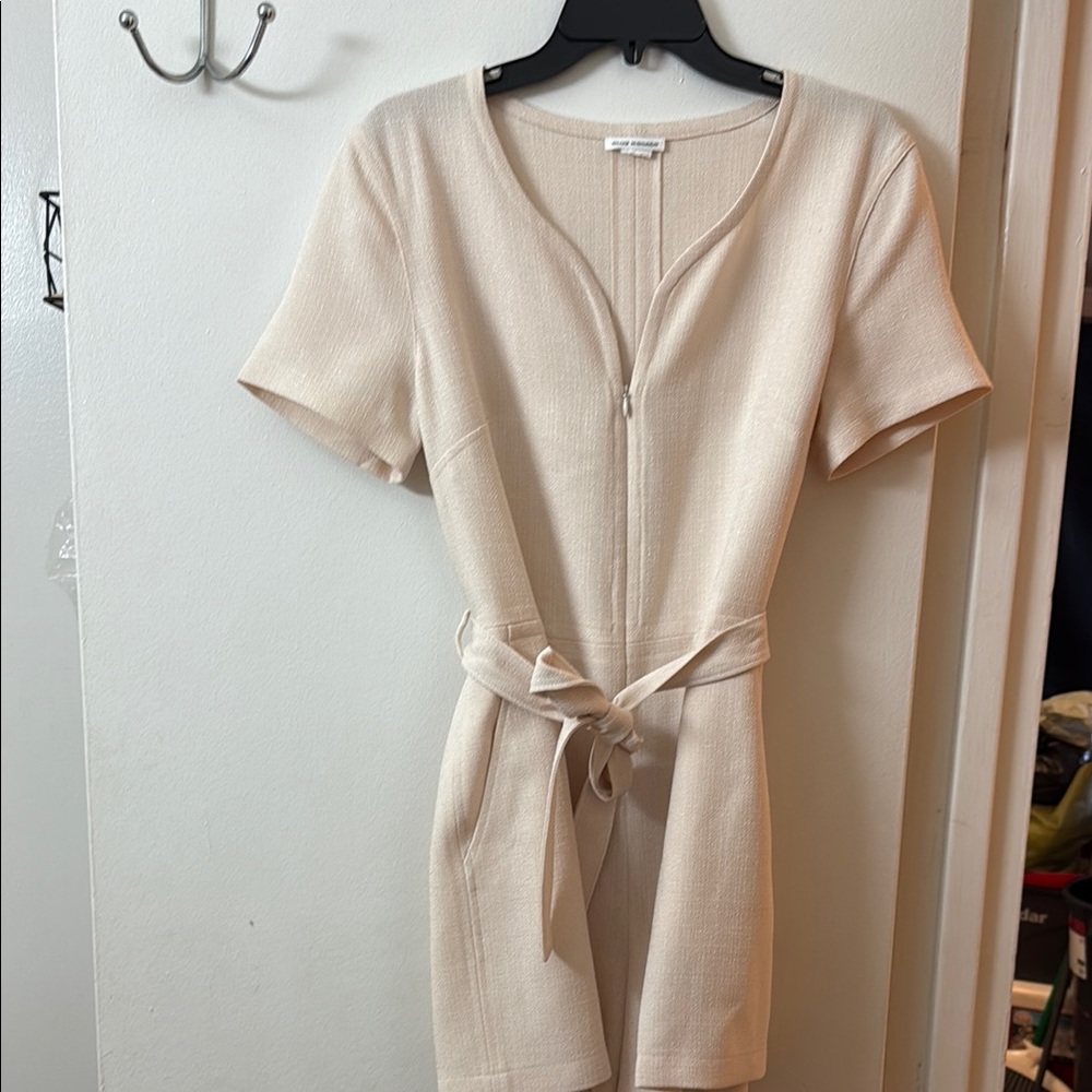 Cream Short Sleeve Belted Romper. It has no size tags